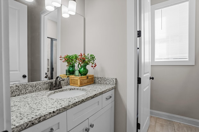 bathroom with tile patterned floors and vanity