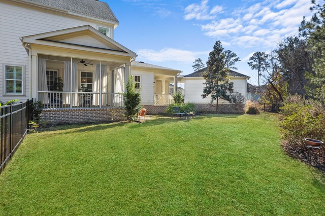 view of yard featuring a sunroom