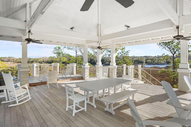 wooden deck featuring a gazebo and a water view