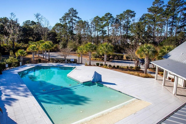 view of swimming pool with a patio area