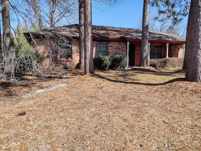 view of front of house with brick siding