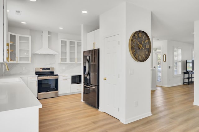 117 Red Leaf Blvd, Moncks Corner, SC 29461 - kitchen with stainless steel appliances, wall chimney range hood, a sink, light wood-type flooring, and recessed lighting