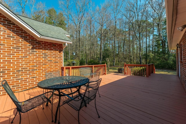 wooden deck with outdoor dining area