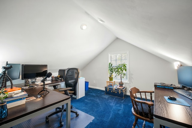 office area featuring lofted ceiling, baseboards, and carpet flooring