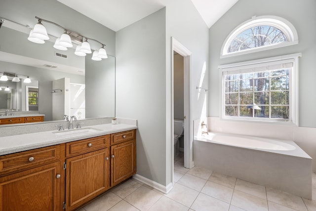 full bath featuring a garden tub, visible vents, toilet, vaulted ceiling, and tile patterned floors