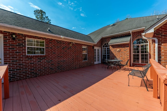 wooden terrace with outdoor dining area