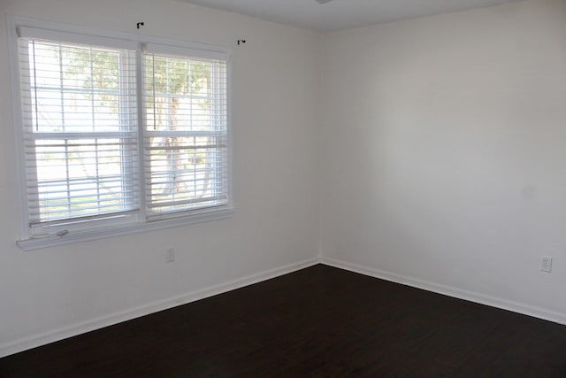 empty room with wood-type flooring