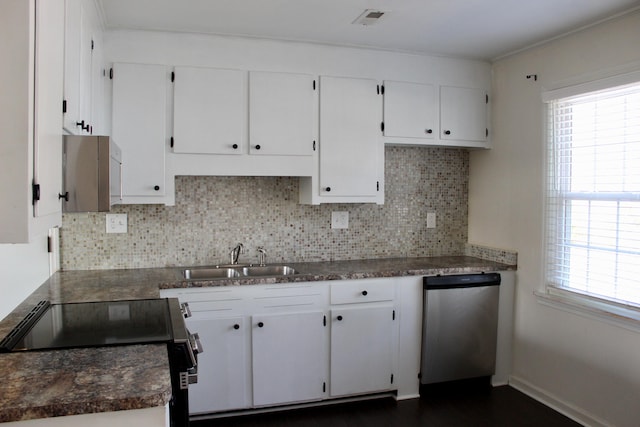 kitchen featuring electric stove, sink, stainless steel dishwasher, and white cabinets