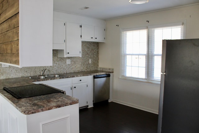 kitchen with white cabinetry, sink, tasteful backsplash, and appliances with stainless steel finishes