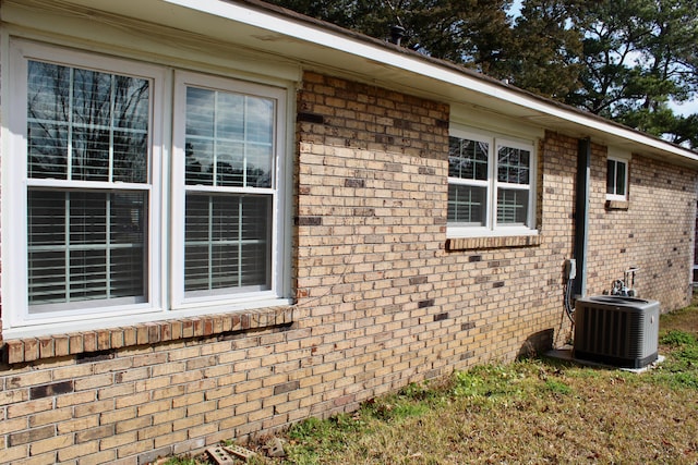 view of side of home featuring central air condition unit