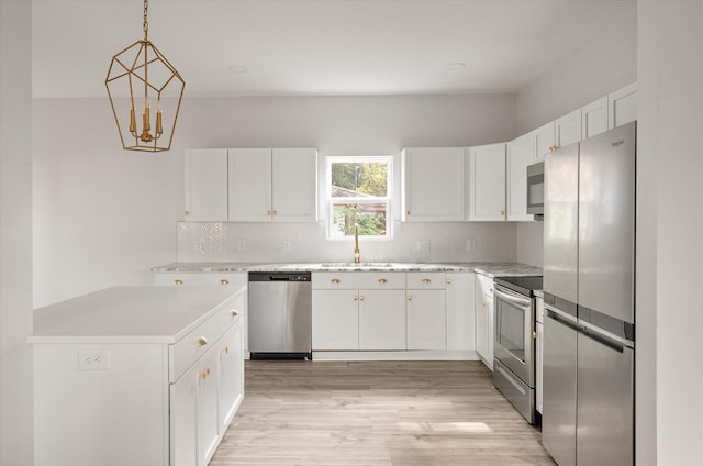 5748 Pilgrim Ave Unit D, Hanahan, SC 29410 - kitchen with stainless steel appliances, light countertops, decorative backsplash, and light wood finished floors