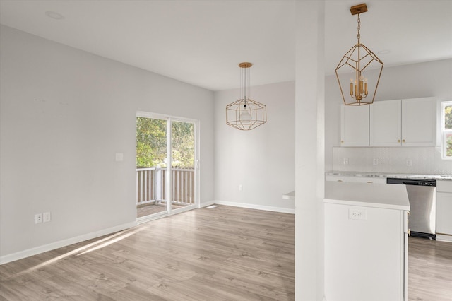 5748 Pilgrim Ave Unit D, Hanahan, SC 29410 - kitchen with dishwasher, light countertops, light wood finished floors, and white cabinets