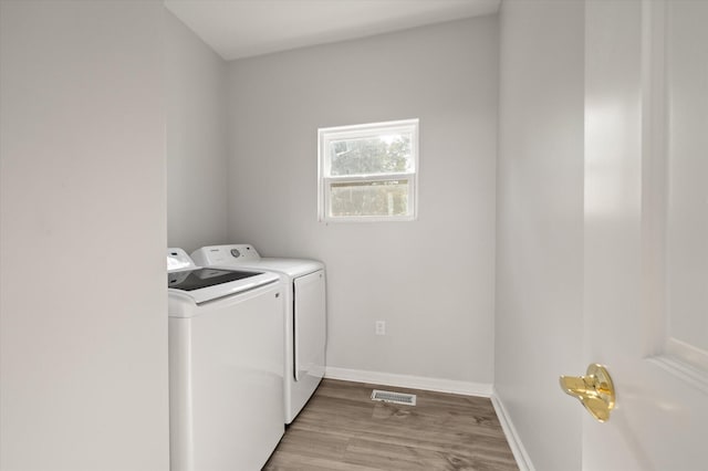 5748 Pilgrim Ave Unit D, Hanahan, SC 29410 - laundry room with separate washer and dryer, light wood finished floors, and baseboards