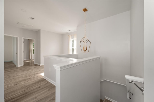 5748 Pilgrim Ave Unit D, Hanahan, SC 29410 - hall featuring an upstairs landing, light wood-type flooring, and baseboards