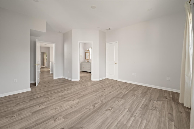 5748 Pilgrim Ave Unit D, Hanahan, SC 29410 - unfurnished bedroom with light wood-type flooring, baseboards, and connected bathroom