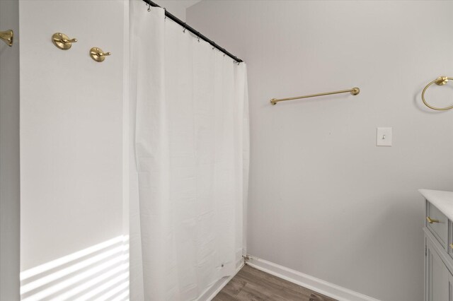 5748 Pilgrim Ave Unit D, Hanahan, SC 29410 - bathroom featuring wood finished floors, vanity, and baseboards