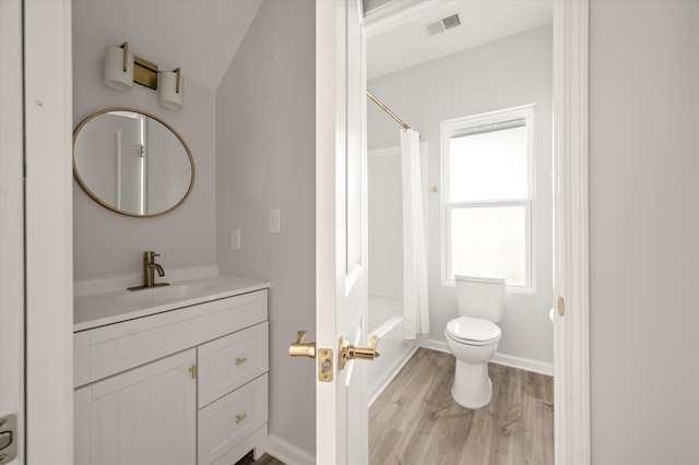 5748 Pilgrim Ave Unit D, Hanahan, SC 29410 - bathroom with vanity, wood finished floors, toilet, shower / bath combo, and baseboards