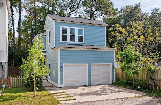 5748 Pilgrim Ave Unit D, Hanahan, SC 29410 - view of front of home with a garage, roof with shingles, and concrete driveway