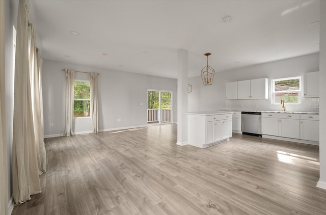 5748 Pilgrim Ave Unit D, Hanahan, SC 29410 - unfurnished living room with plenty of natural light, light wood-style flooring, and baseboards