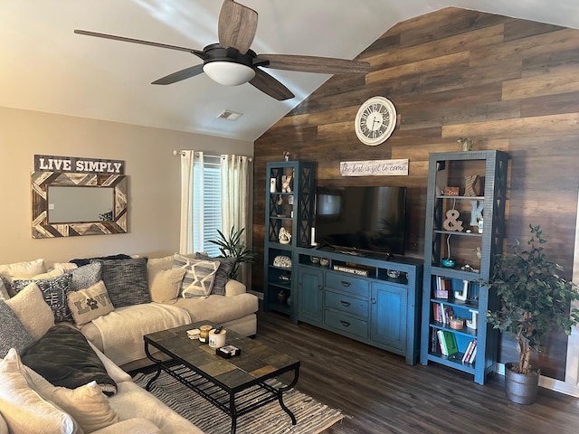 living room with ceiling fan, dark hardwood / wood-style floors, wood walls, and lofted ceiling