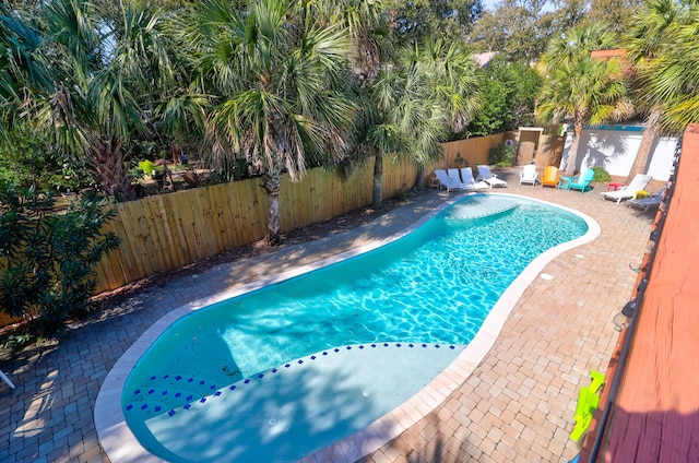 view of swimming pool with a fenced in pool, a patio area, and a fenced backyard