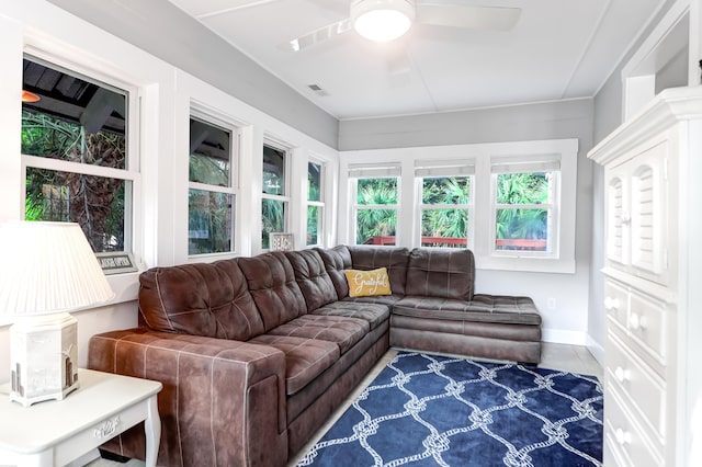 sunroom with visible vents and a ceiling fan