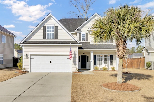 view of front of property with a porch and a garage