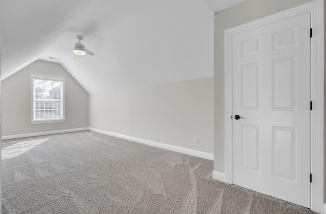 bonus room with lofted ceiling, light colored carpet, and ceiling fan