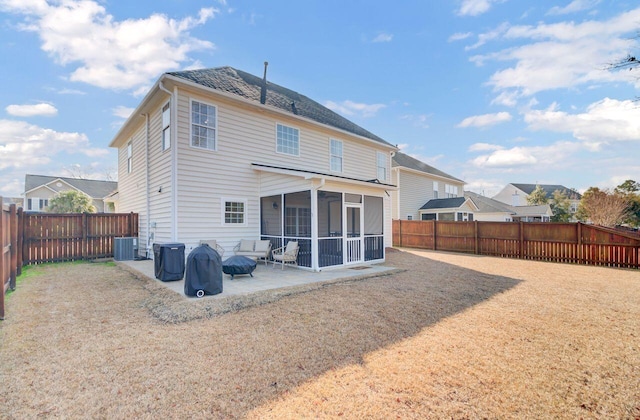 back of property with central AC unit, a patio area, and a sunroom