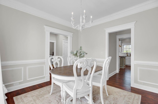 dining space featuring an inviting chandelier, crown molding, and dark wood-type flooring