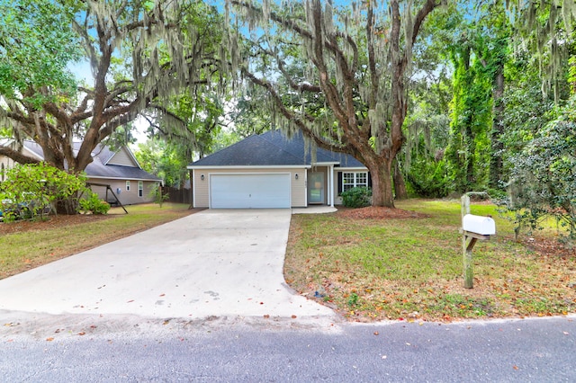 view of front facade featuring a front yard and a garage