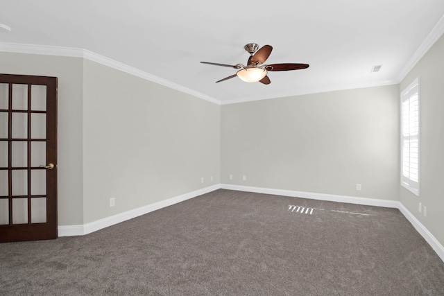 empty room featuring dark colored carpet, french doors, ceiling fan, and ornamental molding