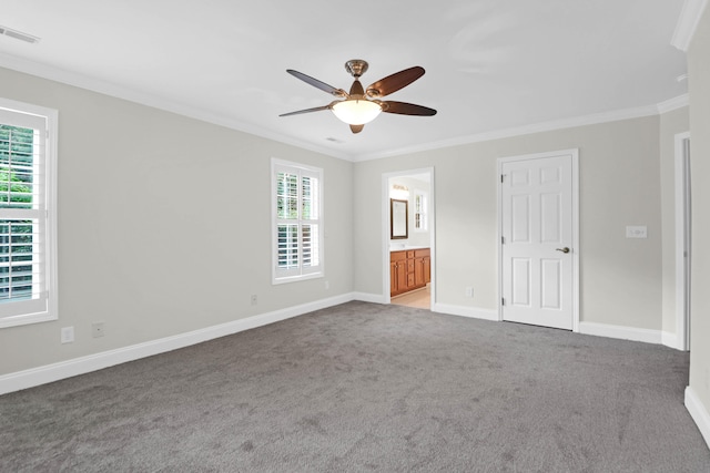 unfurnished bedroom with ceiling fan, ensuite bathroom, and ornamental molding