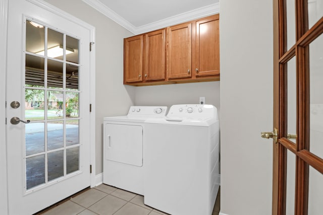 washroom featuring washer and dryer, cabinets, light tile patterned floors, and crown molding