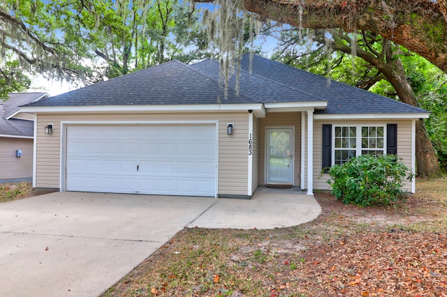 ranch-style house featuring a garage