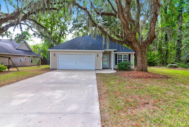 view of front of home with a front yard and a garage