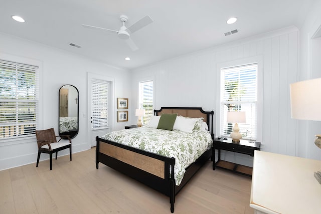 bedroom featuring a ceiling fan, visible vents, light wood finished floors, recessed lighting, and crown molding