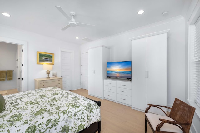 bedroom with light wood-style flooring, recessed lighting, visible vents, and ornamental molding