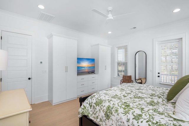 bedroom featuring light wood-type flooring, visible vents, recessed lighting, and crown molding