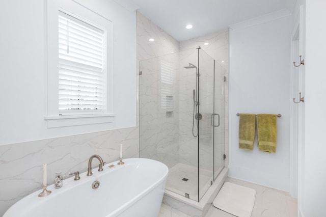 bathroom with a marble finish shower, recessed lighting, marble finish floor, and a freestanding tub