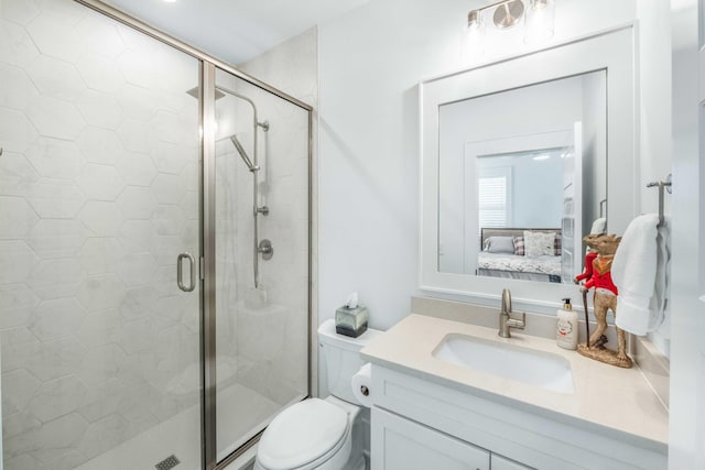 bathroom featuring vanity, a shower stall, and connected bathroom