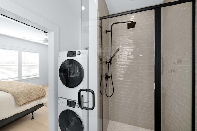 laundry area with laundry area and stacked washer and clothes dryer