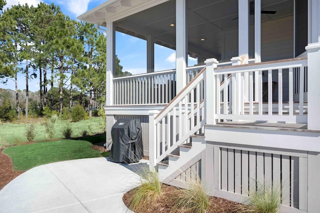 view of patio with a porch and stairway