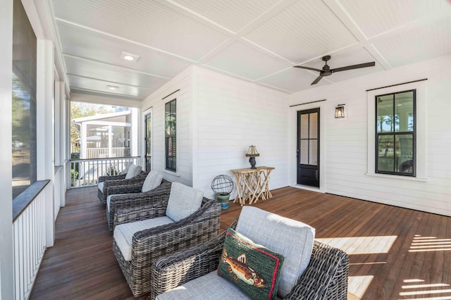 wooden terrace featuring a ceiling fan