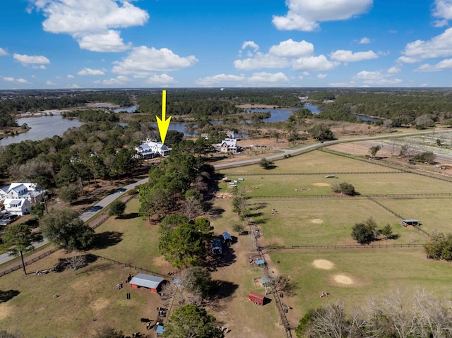 birds eye view of property with a rural view and a water view