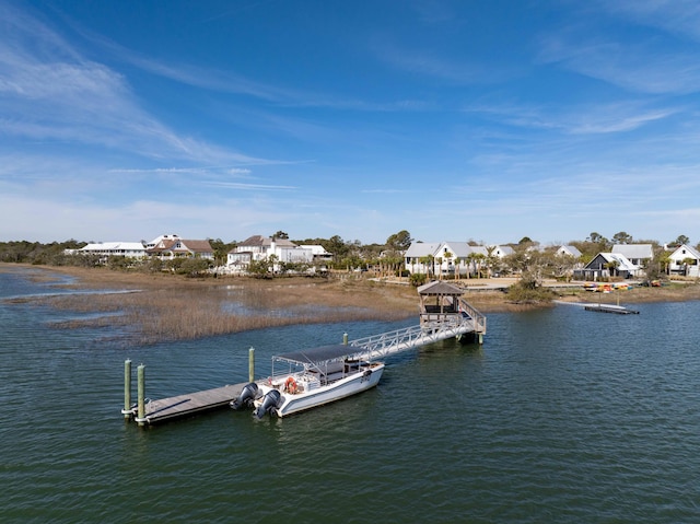 dock area featuring a residential view and a water view