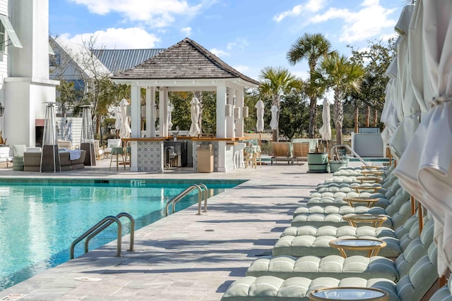 pool with a gazebo and outdoor dry bar