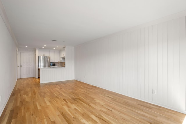 unfurnished living room featuring recessed lighting, visible vents, and light wood-style flooring