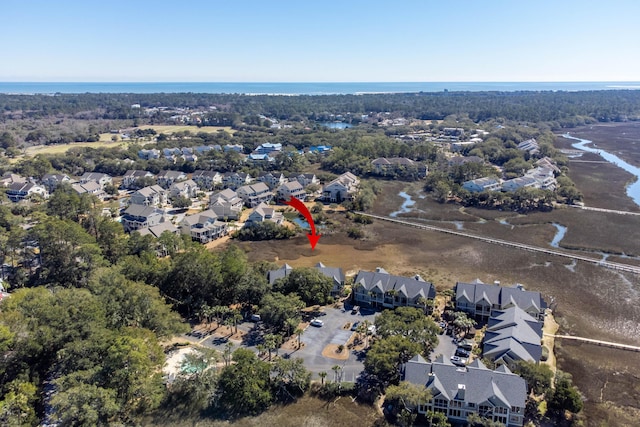 bird's eye view featuring a residential view and a water view