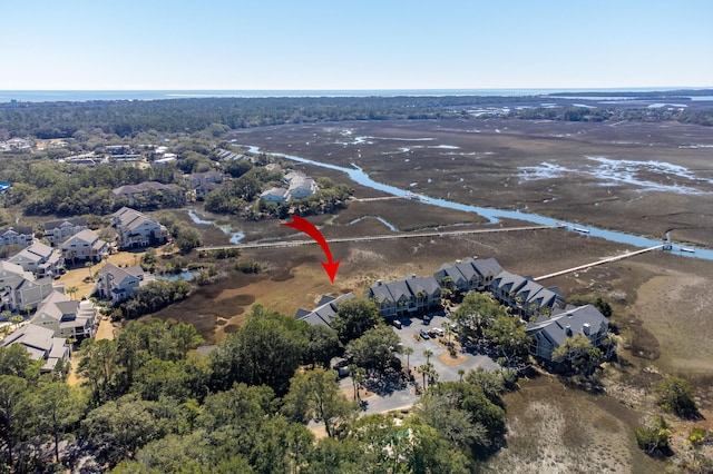 bird's eye view featuring a water view and a residential view